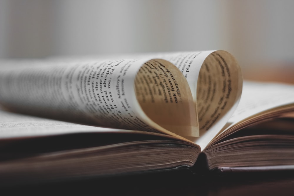 white book page on brown wooden table