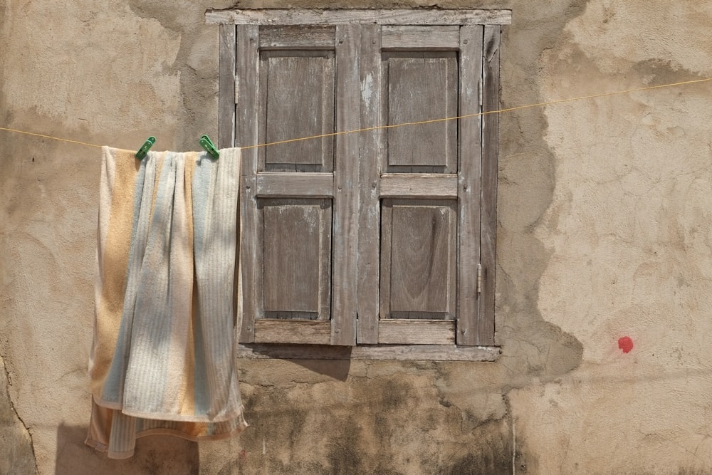 brown wooden door with white textile