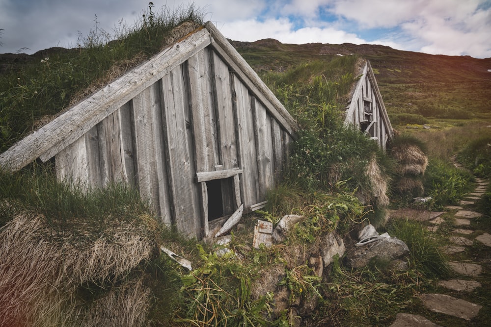 brown wooden house on green grass field