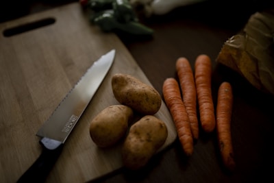 carrots on brown wooden chopping board