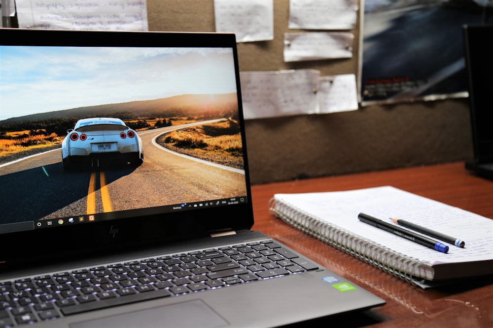 macbook pro on brown wooden table