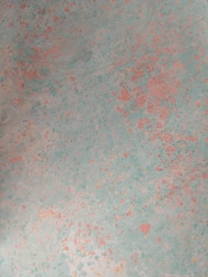 Soft pastel blue pigment powder gently spread on a textured background.