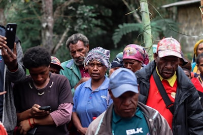 group of people wearing white and blue helmet papua new guinea zoom background