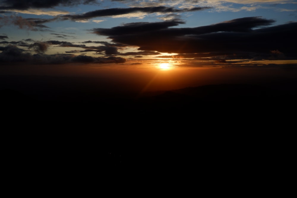 silhouette of mountain during sunset