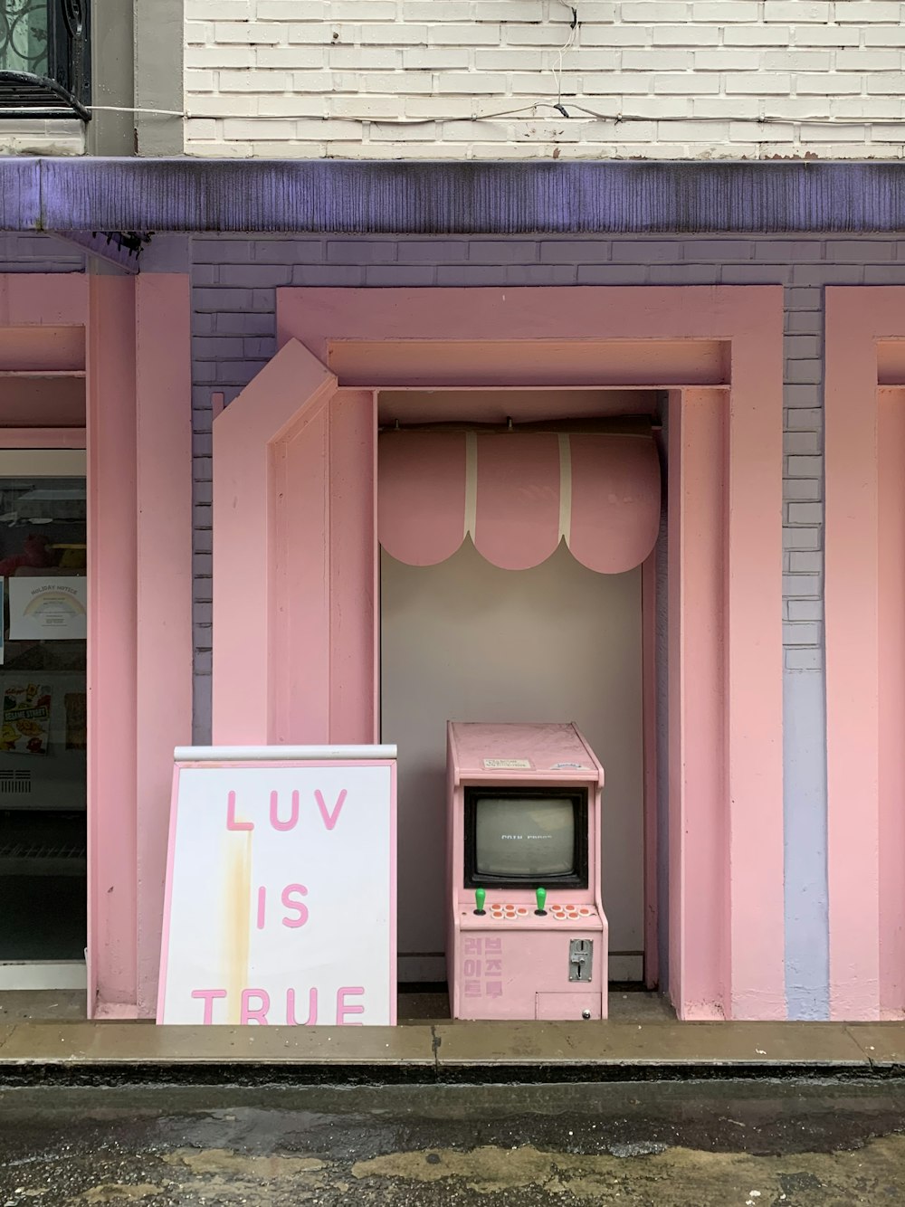 pink and white wooden building