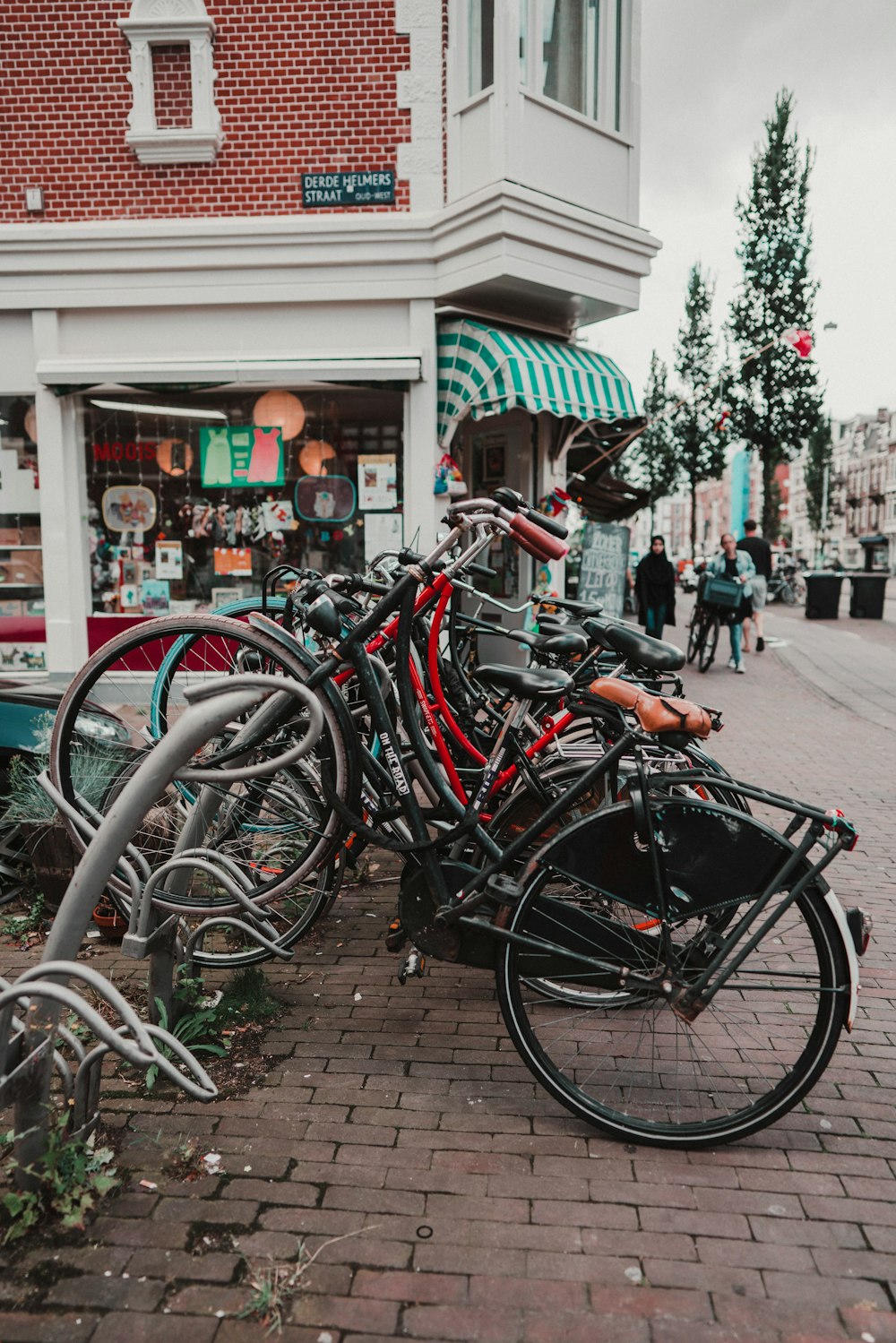 bicycles parked on sidewalk during daytime