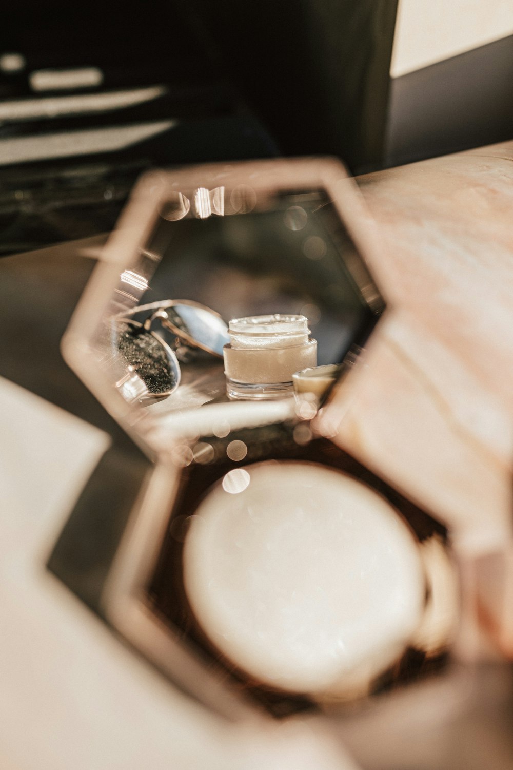 silver round watch on brown wooden table