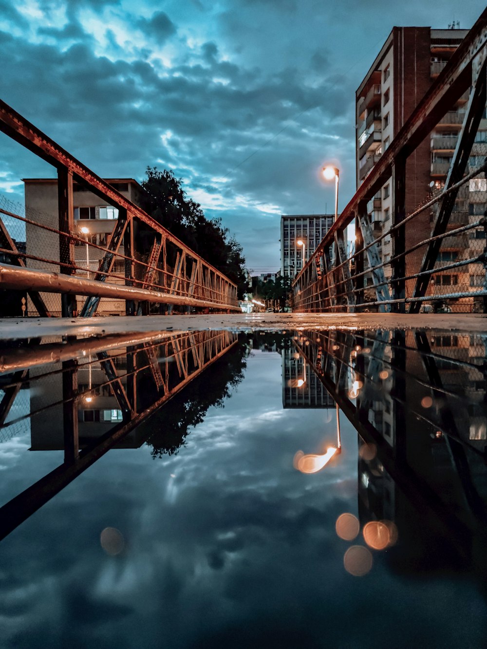 brown concrete building near body of water during daytime