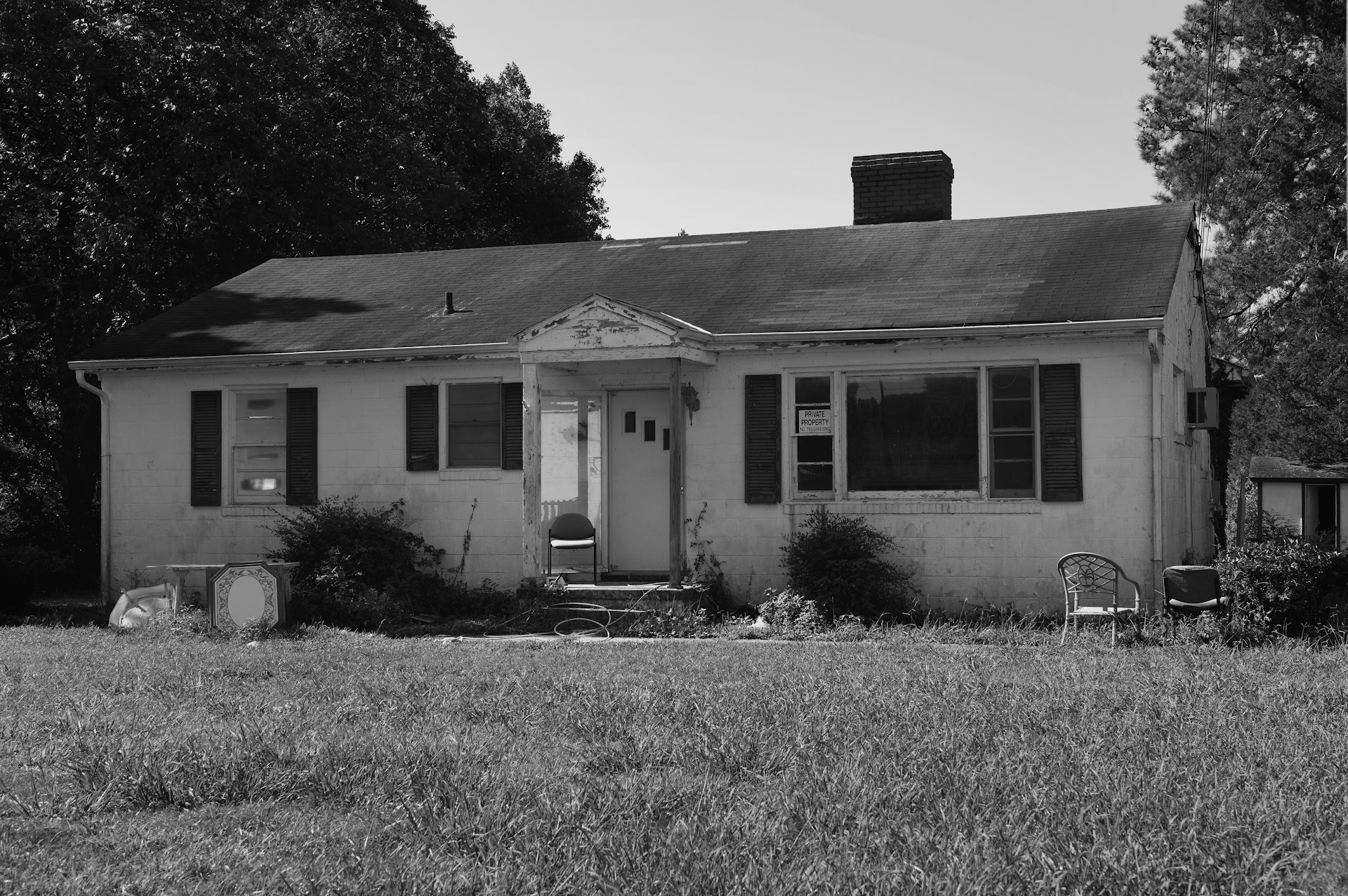 grayscale photo of 2 storey house