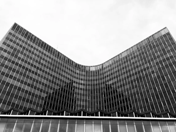 Monochrome photo of a sleek, modern office building with minimalist design reflecting professionalism.