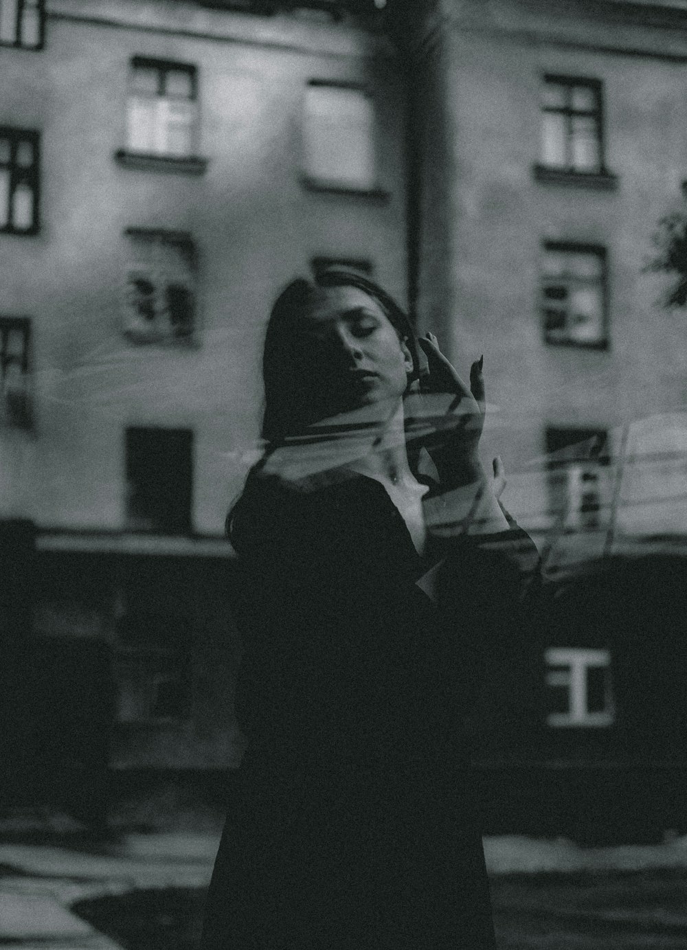 grayscale photo of man in black and white hoodie