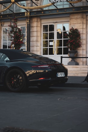 A luxurious private car parked in front of a 5-star hotel in Kolkata.