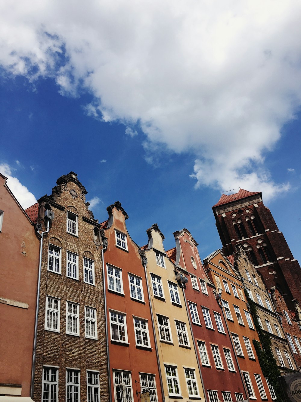 brown concrete building under blue sky during daytime