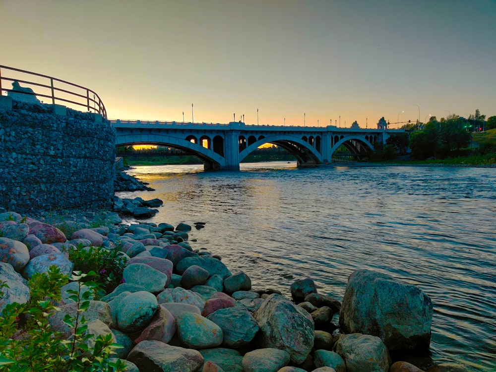 gray concrete bridge over river during daytime