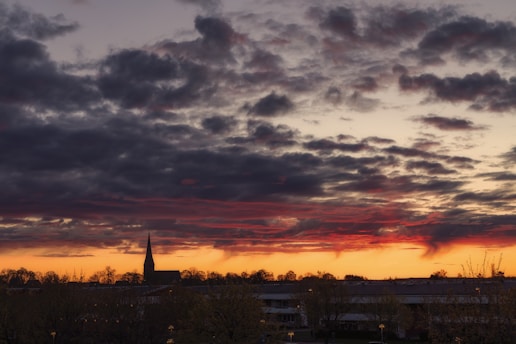 A dramatic sunset over a stormy horizon symbolizing the urgency of end times prophecy.