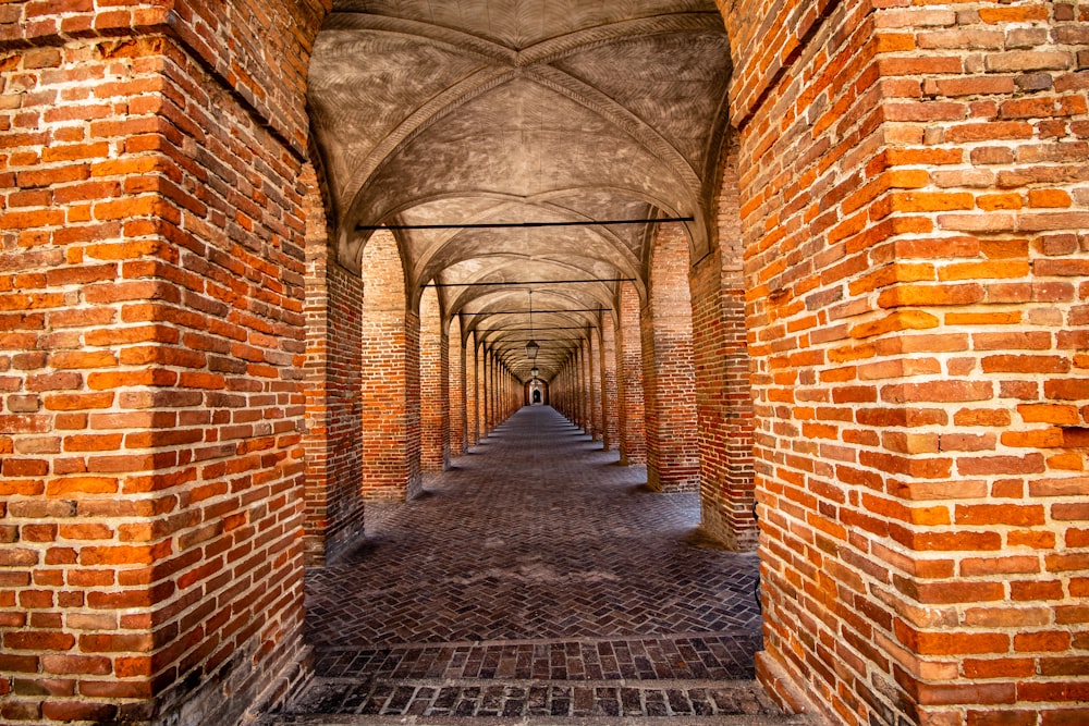 brown brick hallway with no people