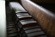 A piano technician adjusting the hammers during a regulation service.