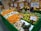 A satisfied shopper browsing through fresh fruits at Vindhya Bazaar.