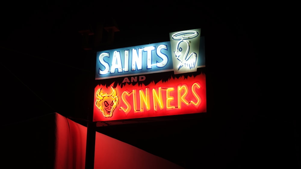 red and white UNKs neon light signage