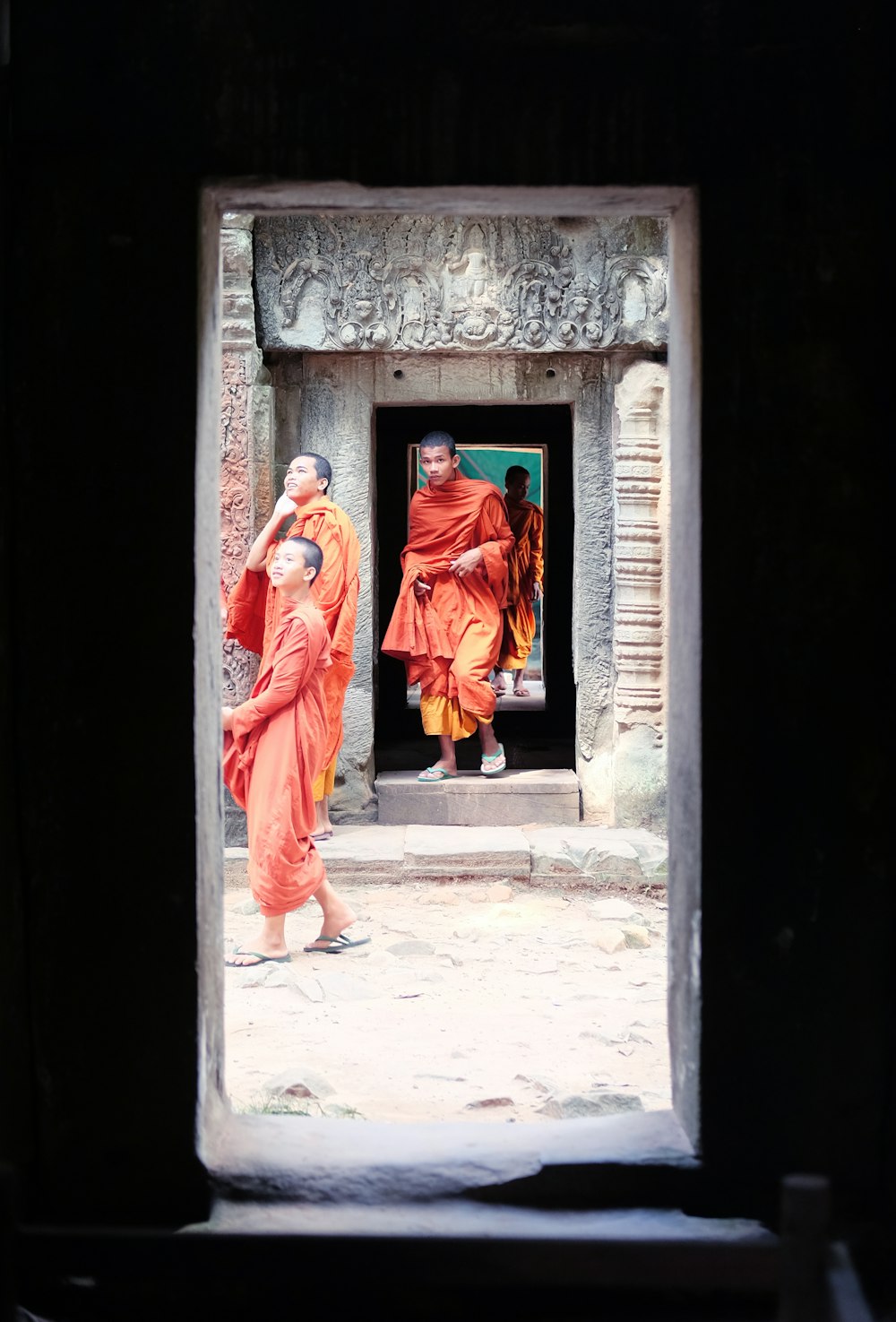 woman in red robe standing on doorway