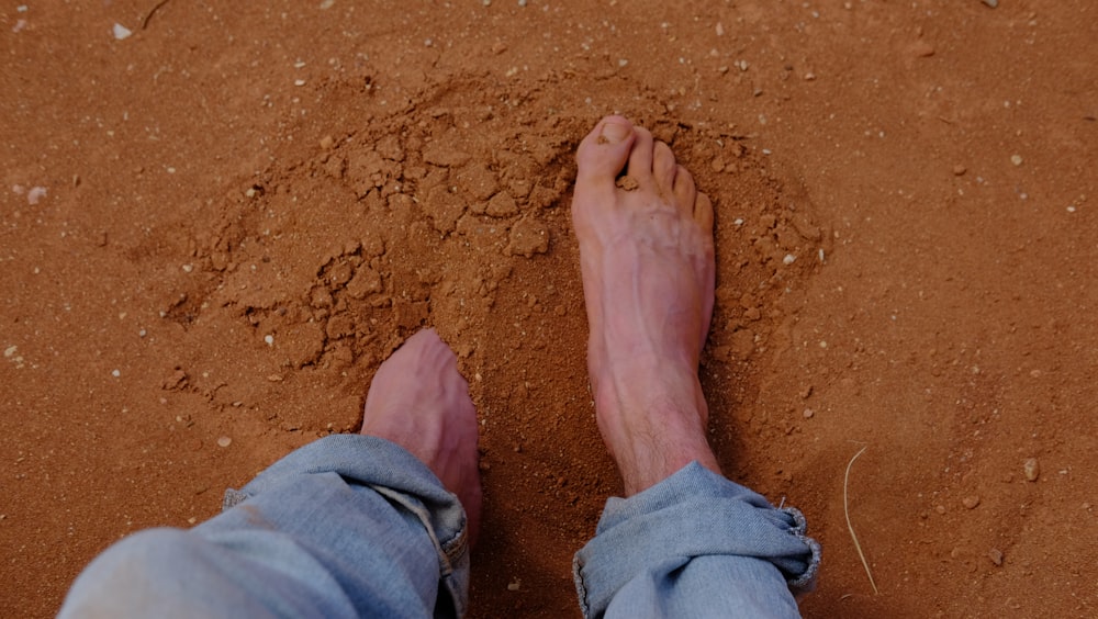 person in blue denim jeans