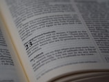 A close-up view of a page from a book, likely a Bible, highlighting the text about 'The appointed festivals' in Leviticus 23. The page is open and well-lit, with the text clearly in focus, showing detailed scripture.