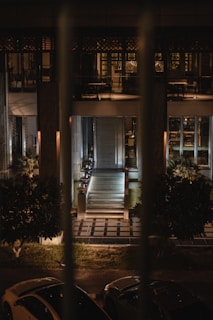 Evening scene of max’s exterior with soft golden lighting highlighting the entrance