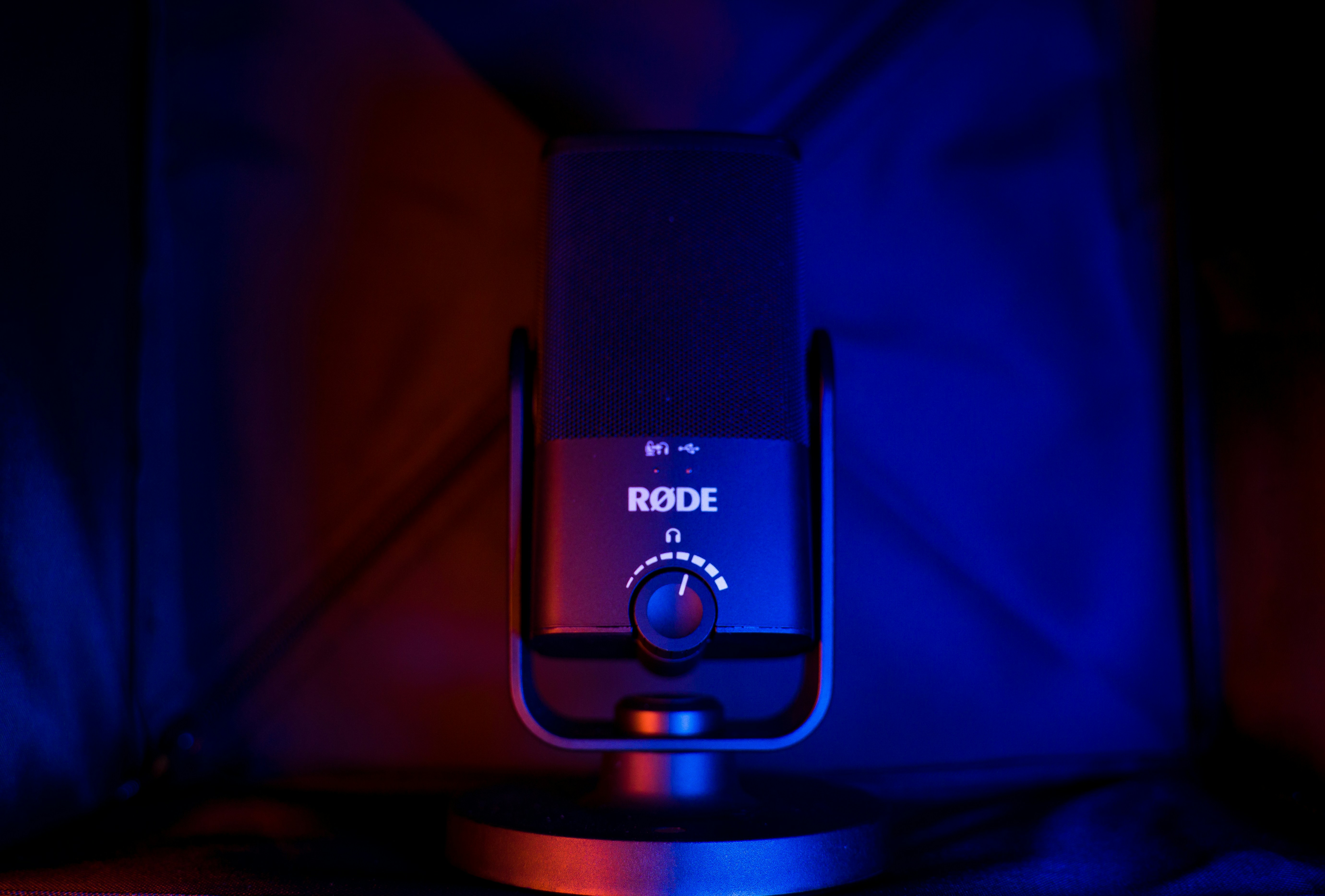 black and silver speaker on brown wooden table