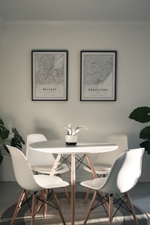 white and brown wooden table with chairs