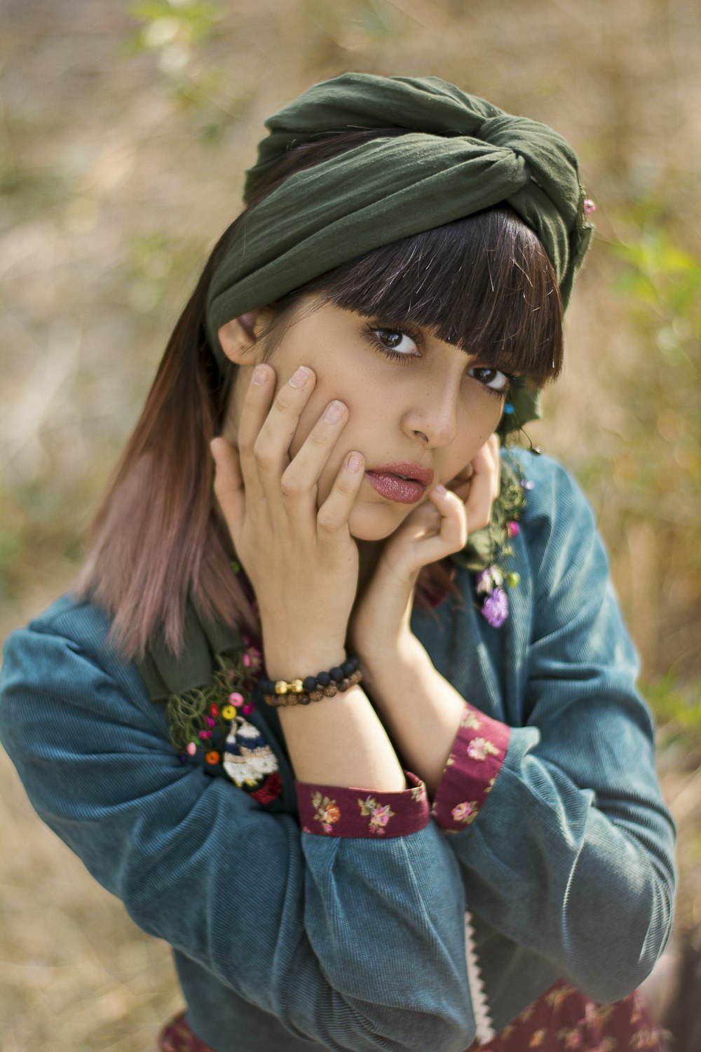 woman in blue denim jacket wearing black hat