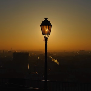 black street lamp during sunset