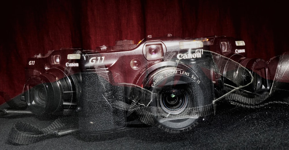 black and silver canon dslr camera