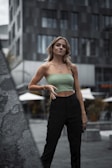 A model wearing a stylish blouse in a chic urban setting.