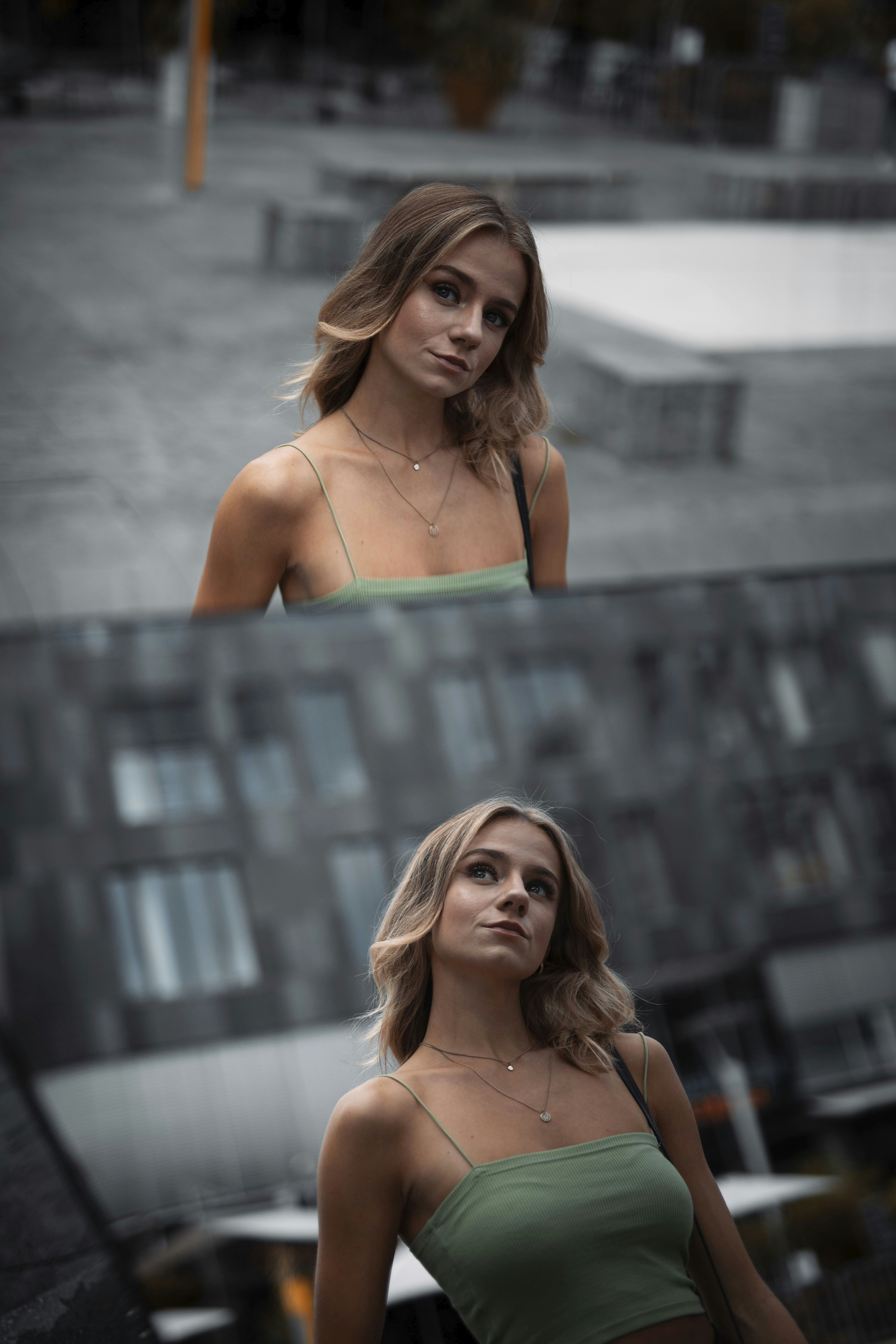 woman in teal spaghetti strap top