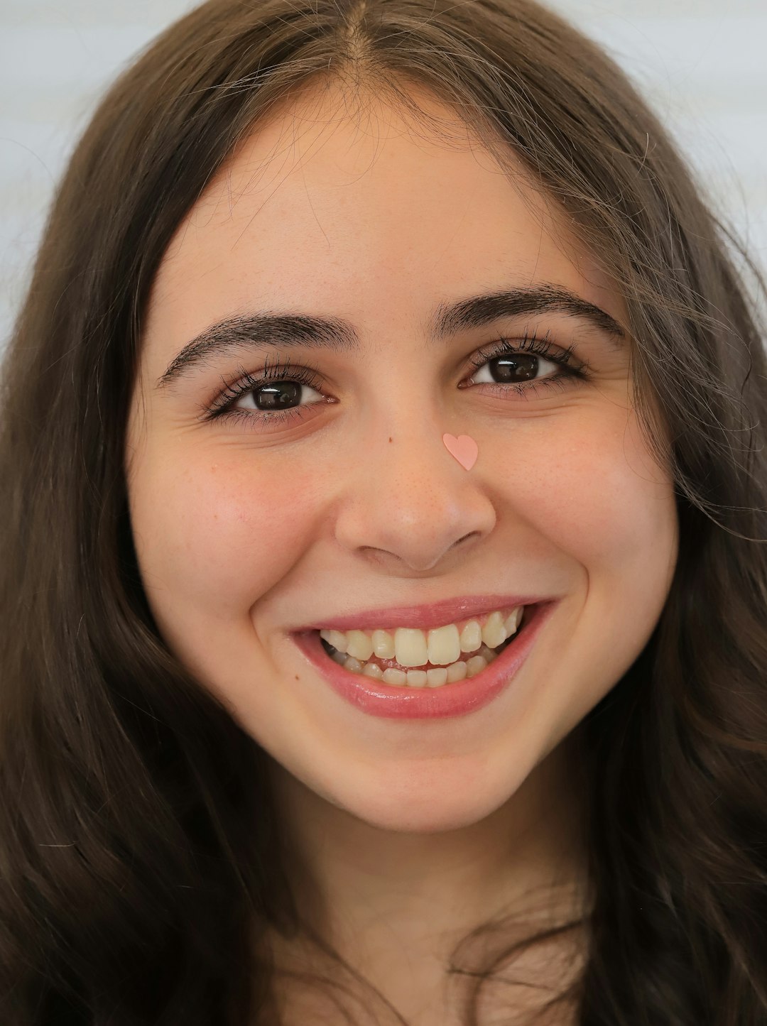 smiling woman in white shirt