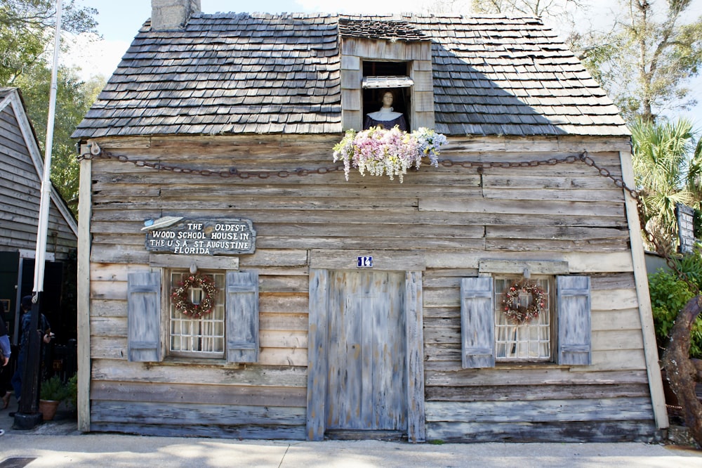 brown wooden door with flowers on top