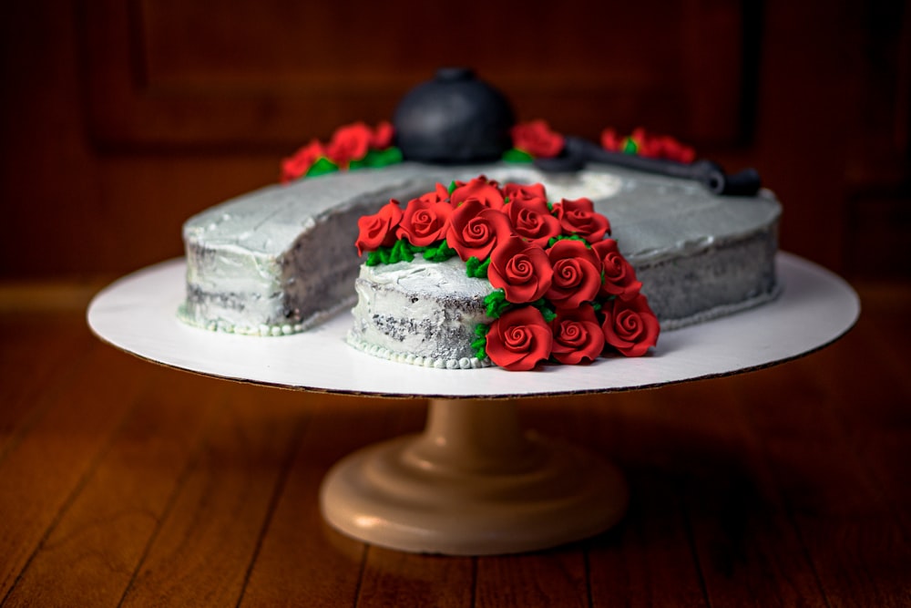 white cake with red and green icing on top