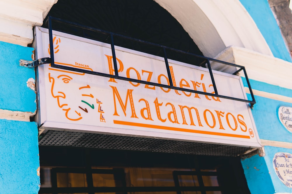 white and brown store signage