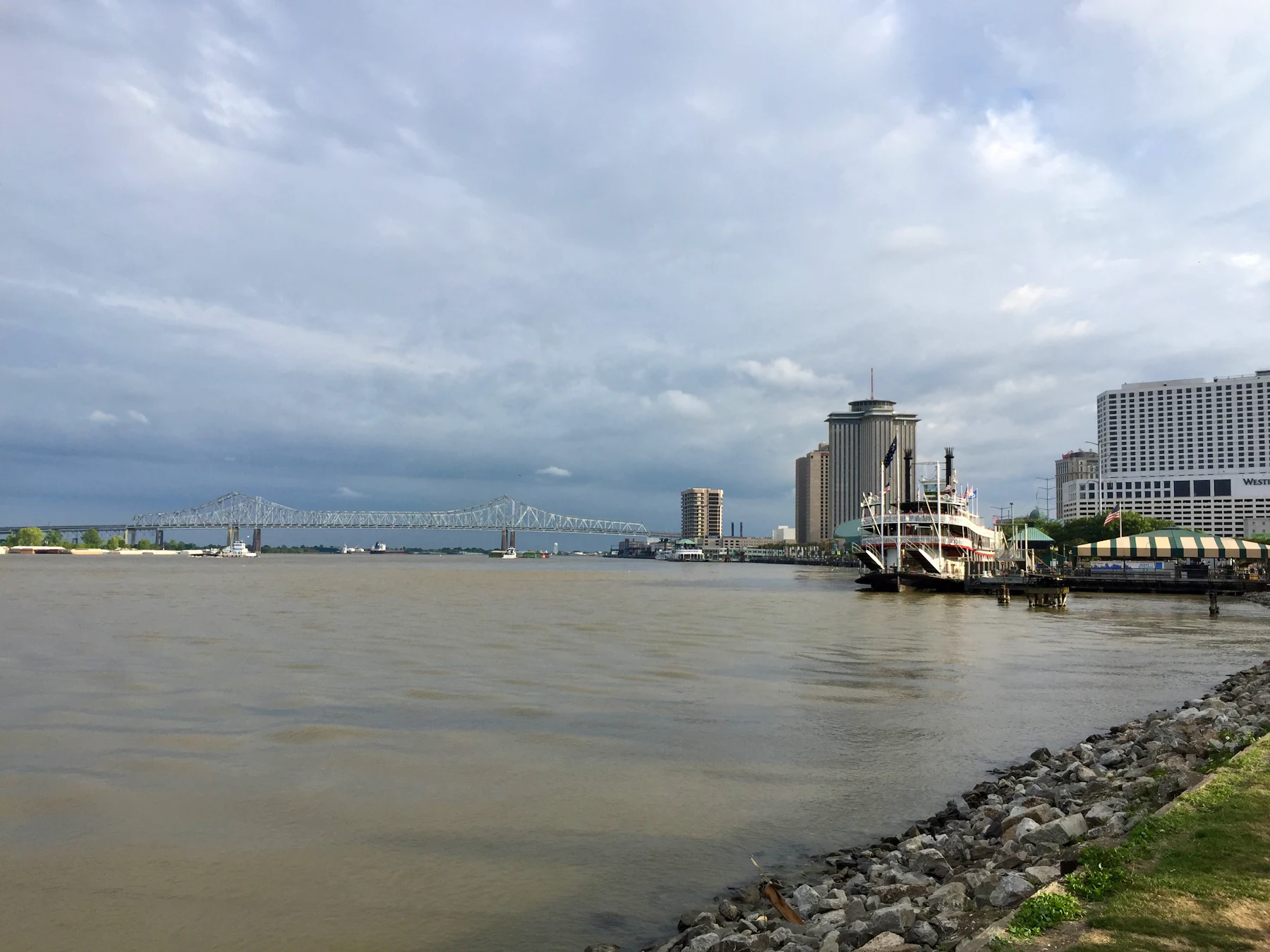 City skyline across the water under a cloudy sky, Mississippi