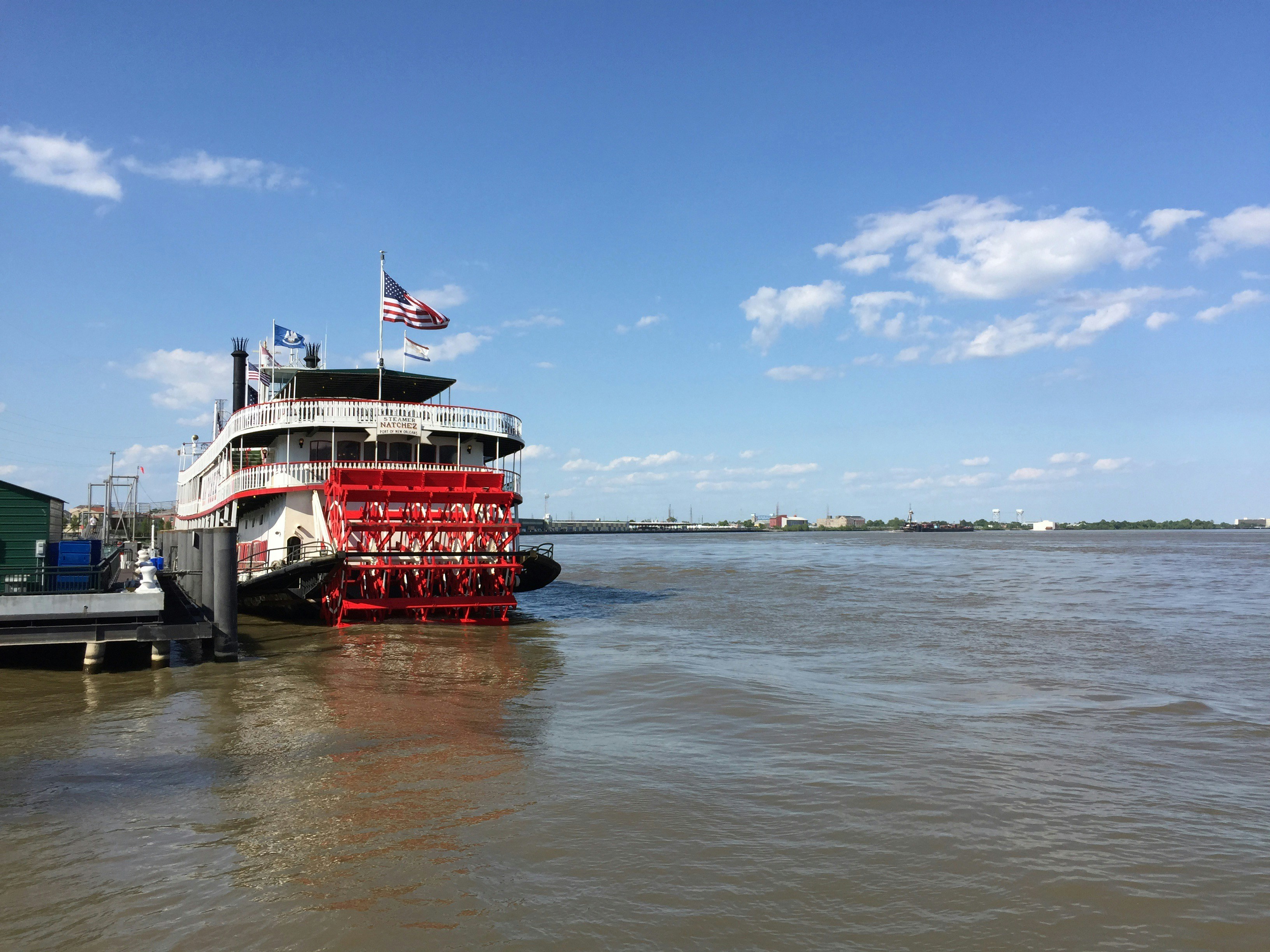red and white boat on sea under blue sky during daytime, Steamboat Natchez in the Mississipi River, New Orleans, LA