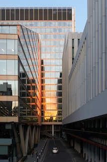 Downtown office building with reflective glass windows in golden hour light.