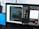 A laptop displaying a dual-screen setup with coding scripts on one side and a YouTube video on the other. The scripts are in a code editor, while the YouTube side shows a video tutorial about using the Fetch API in JavaScript. There are multiple tabs open, and a file explorer is visible.