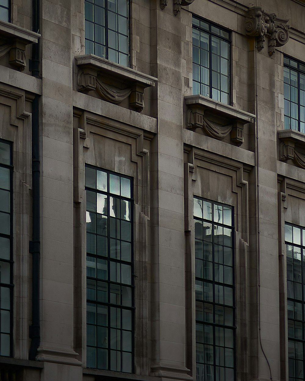 gray concrete building with glass windows