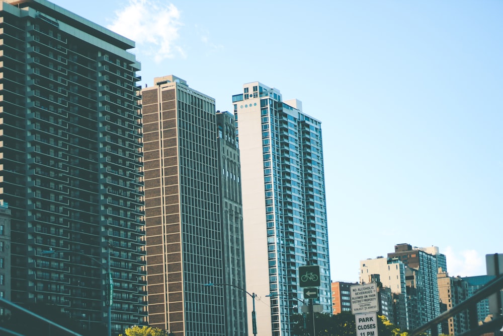 a couple of tall buildings sitting next to each other