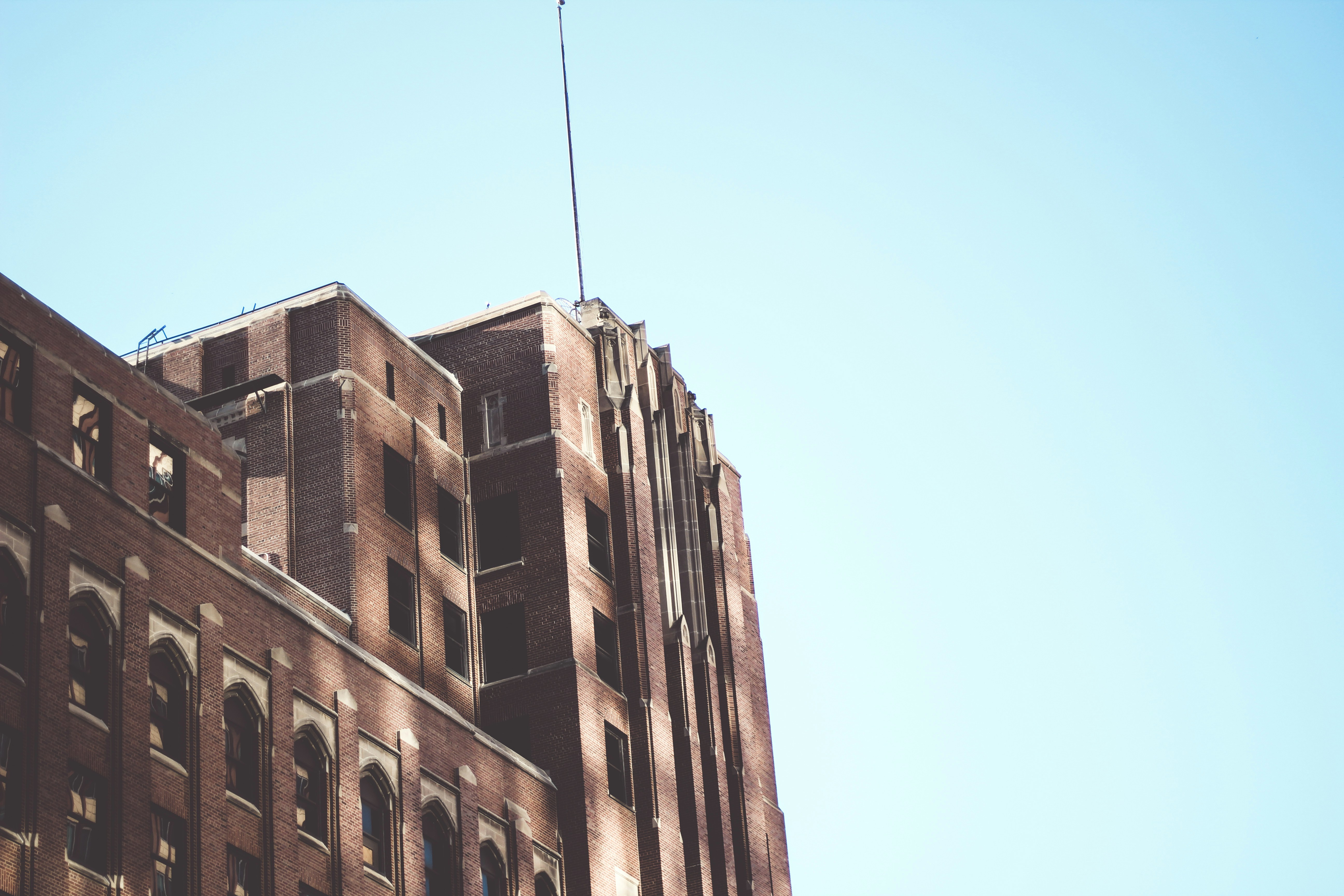 a tall building with a flag on top of it