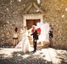 bride and groom walking on street