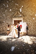 bride and groom walking on street