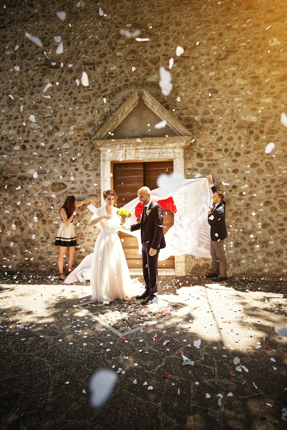 bride and groom walking on street