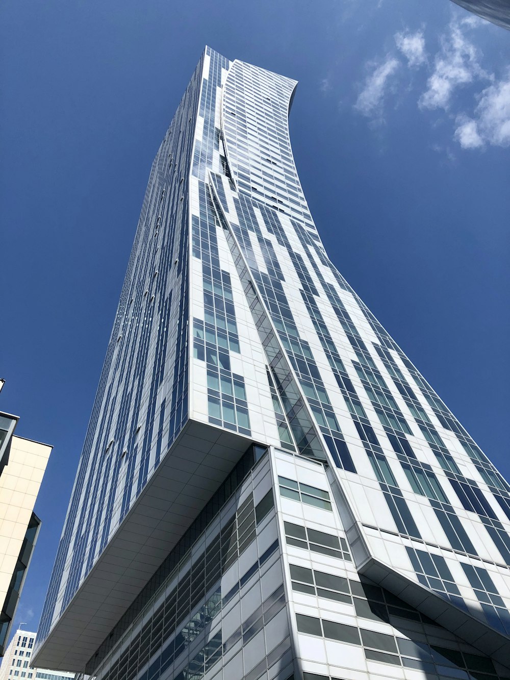 white concrete building under blue sky during daytime