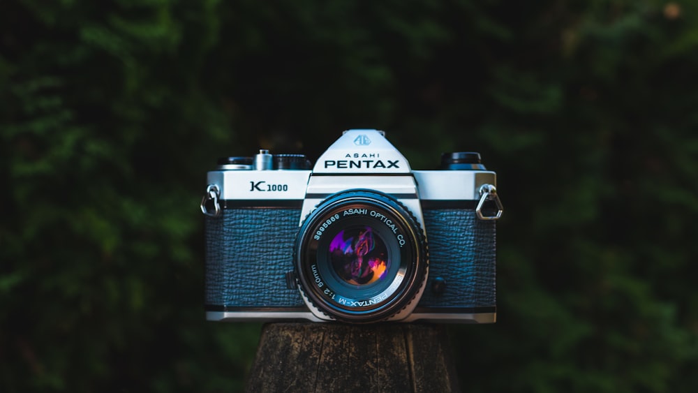 black and silver canon bridge camera